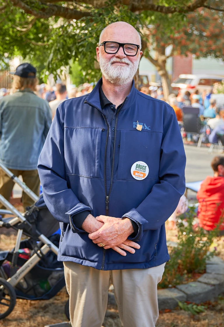 Bruce McGuigan talking with people at a local market